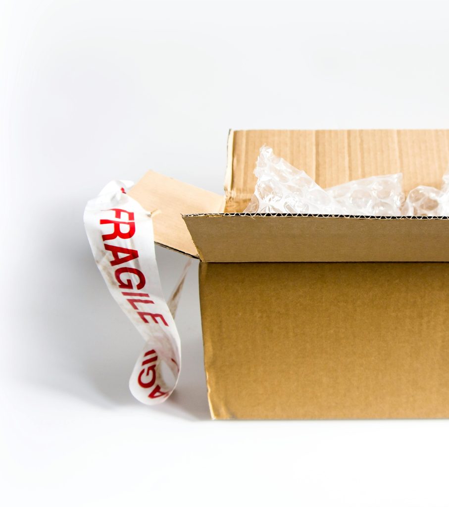 picture of a a open cardboard box showcasing How Professional Removal Companies Protect Fragile Items